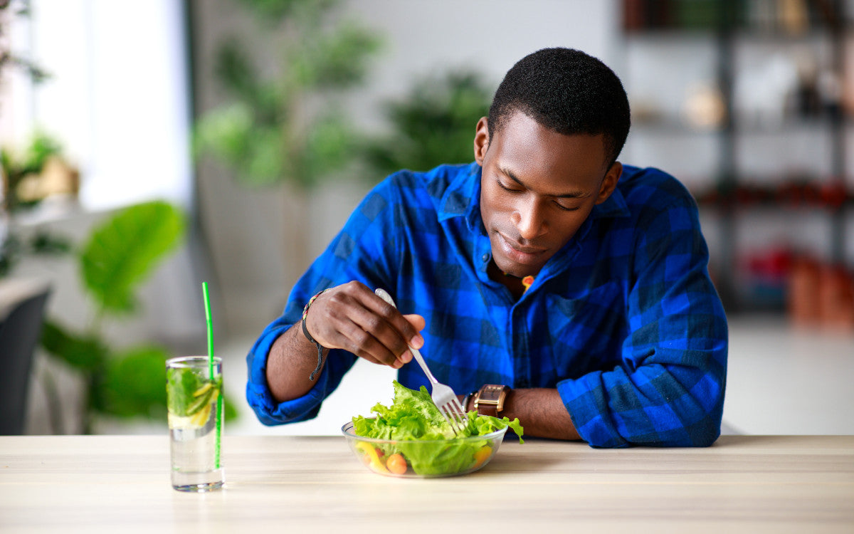 Man eating salad