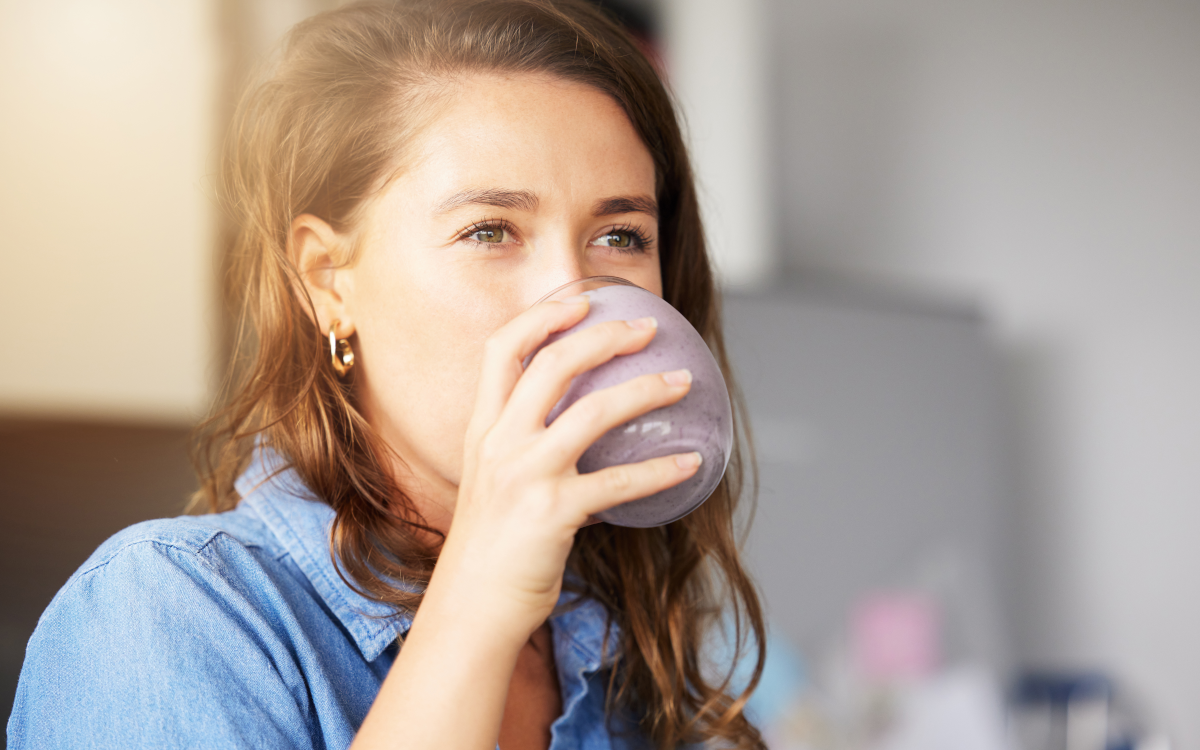 woman drinking smoothie