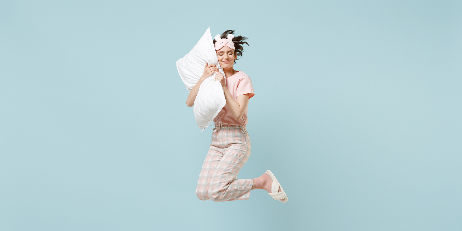 Woman jumping up after a deep sleep