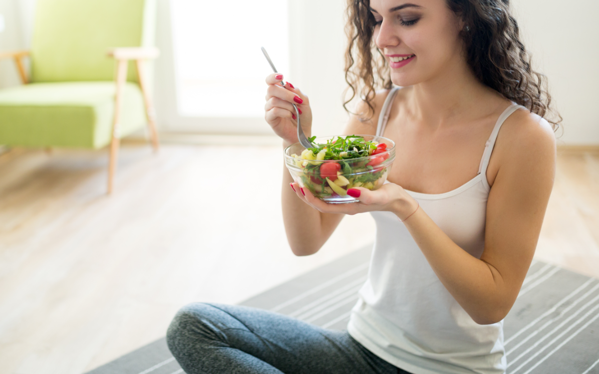 Woman eating salad