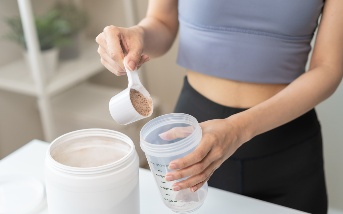Woman making meal shake