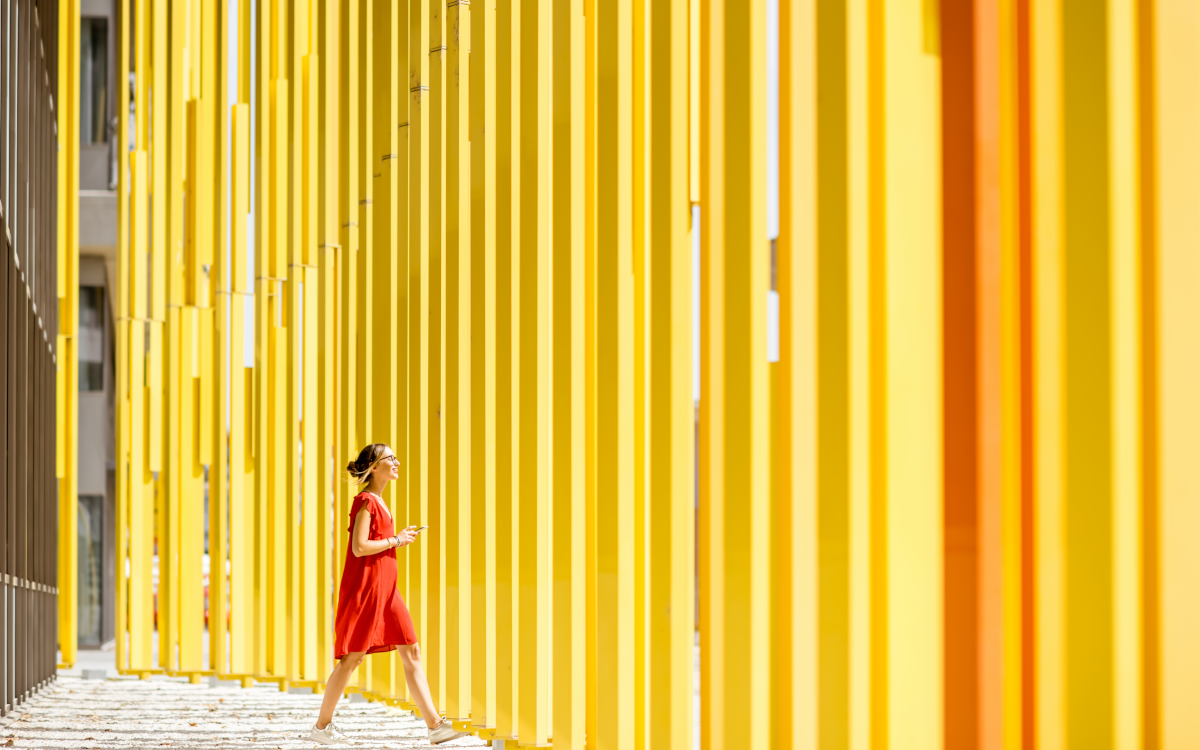 woman walking through colorful place